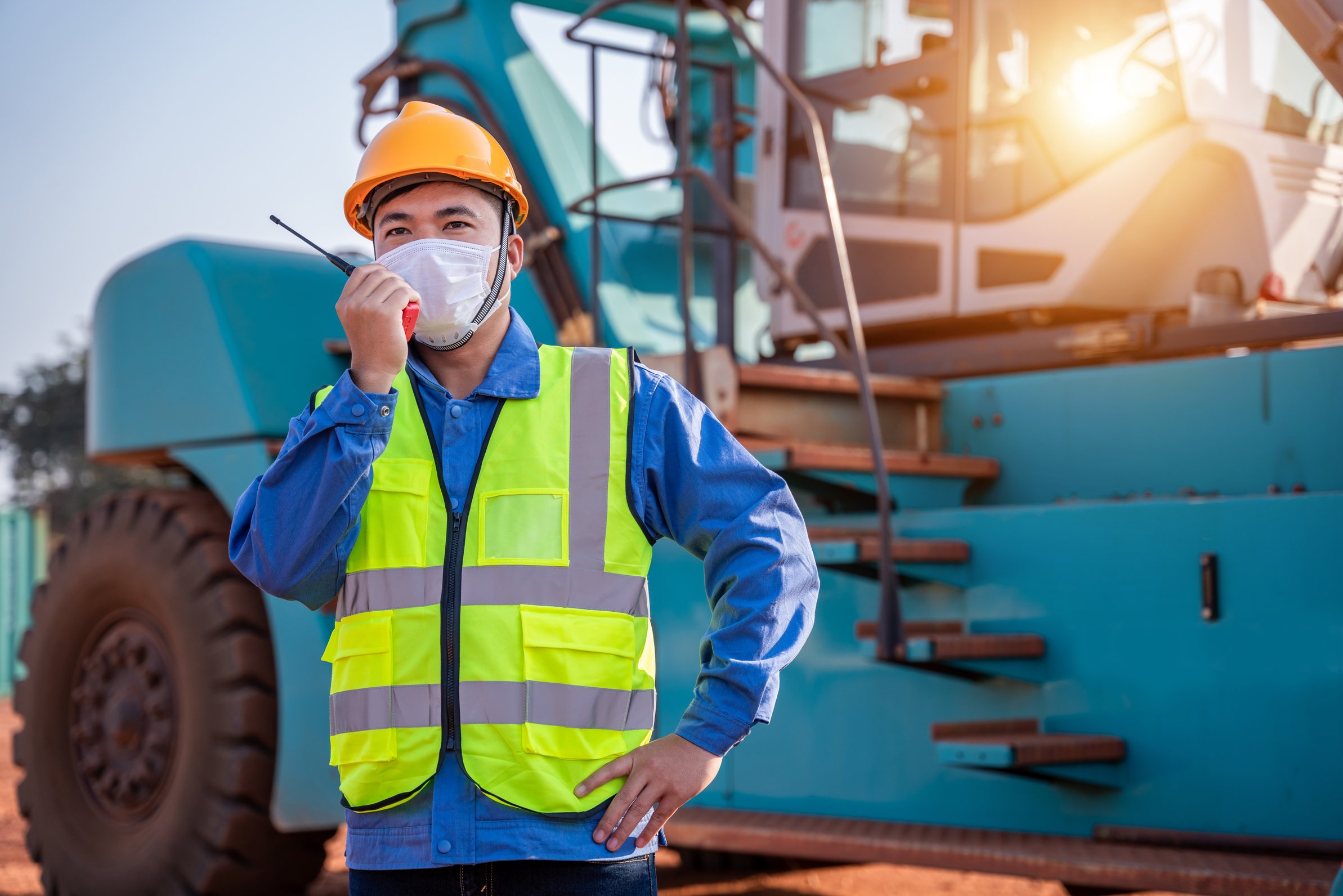 Warehouse asian man worker driver truck driver crane lifting